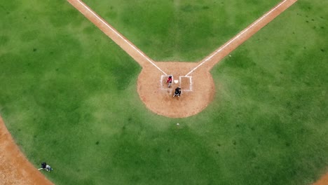 San-pedro-de-macoris,-DR---March-12,-2021---top-view-of-young-Kids-practicing-baseball-at-stadium-in-san-pedro-de-macoris,-open-season-training,-dominican-republic