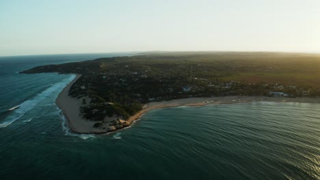 Evening-drone-shot-over-the-coastline-of-Tofo,-Mozambique