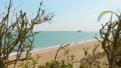 Paragliding-On-The-Beach-Of-Oleron-Island-With-Fort-Boyard-Fort-Boyard-Background-In-The-Atlantic-Coast-Of-France