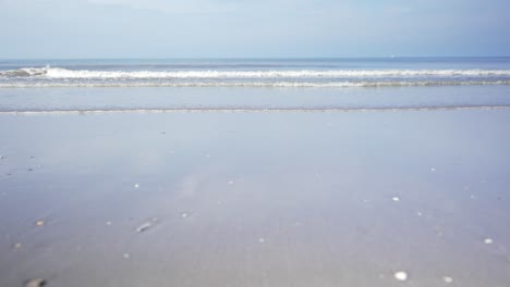 Small-waves-on-the-beach,-low-angle