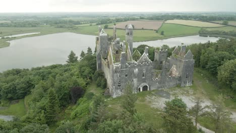 Gothic-Revival-Style-Of-Dromore-Castle-Abandoned-On-Top-Of-Hill-In-County-Limerick,-Ireland