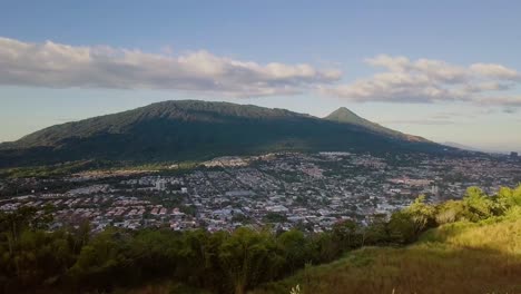 Beautiful-Town-Landscape-View-From-Lush-And-Grassy-Mountainside-At-Santa-Tecla,-El-Salvador