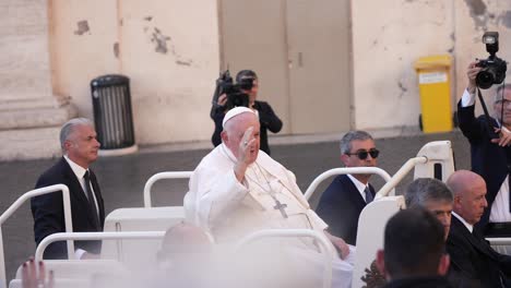 People-greeting-the-pope-Francisco-in-his-popemobile-car-in-Vatican-city-cinematic-slow-motion-close-up-shot