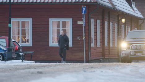 Advent-candles-in-the-windows-of-a-traditional-Swedish-wooden-building,-during-the-covid-19-pandemic