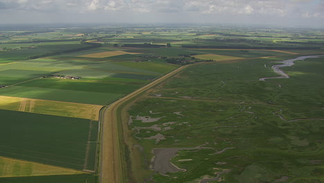 wide-angle-shot-of-green-landscape-in-a-tidal-flood-area-during-daytime-showing-fertile-land