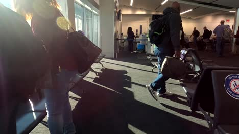 Passengers-sitting-in-Atlanta-airport-waiting-on-flight-to-board