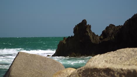 Sea-waves-splash-on-rocks-of-pristine-coast-of-Hang-Rai-Bay,-Vietnam