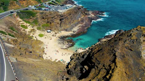 Descending-a-steep-cliff-towards-the-cove-while-revealing-the-stunning-Ohau-coastline