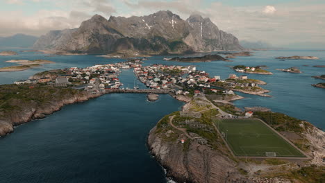 Henningsvær,-Lofoten-Norway-cinematic-aerial-drone-shot-of-archipel-islands-with-football,-soccer-field