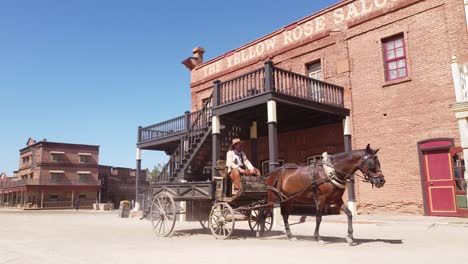 Horse-riding-cowboy-at-Oasis-Mini-Hollywood-in-the-Tabernas-Desert-in-Almeria,-Andalucia,-Spain