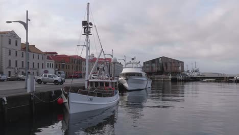 View-from-Hobart-dock-with-two-boats-and-Mac-1-architecturally-design-building,-Hunter-Street-historic-architecture