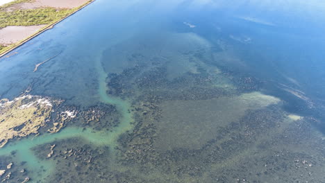 Aerial-hovers-low-over-the-unique-underwater-structures-formed-by-salt-pans-evaporating-and-the-crystallisation-of-sodium-chloride-from-sea-water