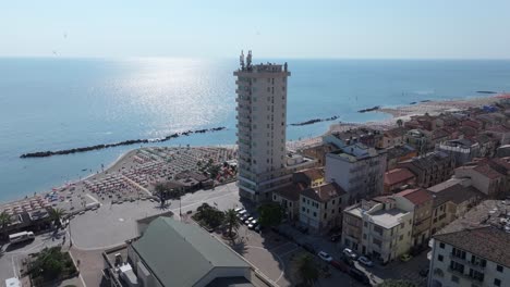 lively-birds-join-us-on-our-aerial-journey-to-the-coast-of-Porto-Recanati,-Piazza-Brancondi,-Italy