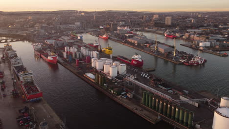 Aerial-view-of-Aberdeen-harbour-and-city-at-sunset---Aberdeenshire,-Scotland,-UK