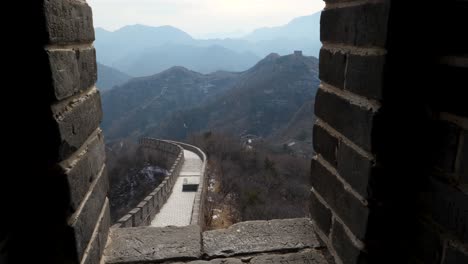 Experience-a-breathtaking-reveal-of-the-Great-Wall-of-China-as-it-extends-through-the-mountains,-captured-in-slow-motion