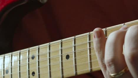 Guitarist-Hand-Moving-Up-and-Down-Fretboard-of-Stratocaster-Guitar-Playing-Various-Chords-4K