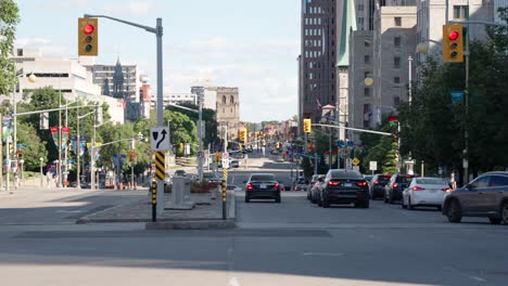 Shot-of-Elgin-street-in-downtown-Ottawa,-Canada-on-a-sunny-summer-day-before-Canada-Day-2022---4K-slow-motion