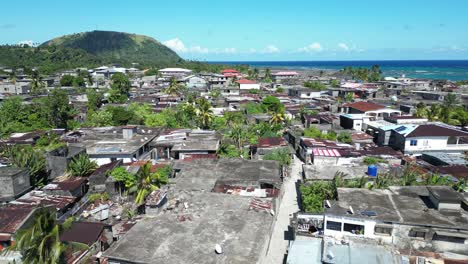 Aerial-View-Of-Small-Town-Slum-In-Comoros,-Populated-Urban-Residential-Area-With-Dense-Houses-and-Sheet-Roofs