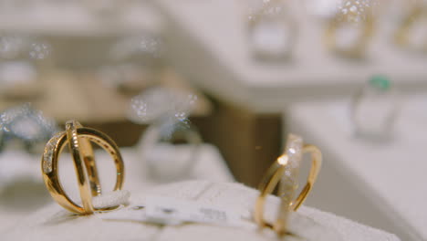 Gold-Rings-with-Precious-Pearls-Rotating-in-a-Shop-Window