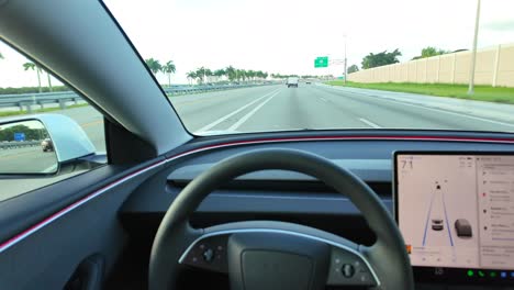 Driver's-POV-of-Tesla-Model-3-Autonomous-Self-steering-Autopilot-Car-Self-Driving-on-Florida-Turnpike-Highway