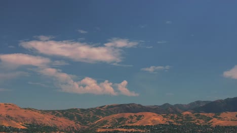 Downtown-Salt-Lake-City-SLC-Utah-USA-Wasatch-Mountain-Range-aerial-drone-opening-scene-pan-down-summer-blue-sky-morning-afternoon-LDS-temple-The-Great-Salt-Basin-Lake-County-region-office-buildings