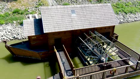 Aerial-view-of-ship-mill-with-large-water-wheel-on-Danube-River,-Baja-Hungary