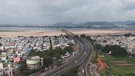 Aerial-video-of-vijayawada,-a-bustling-metropolis-near-the-Andhra-Pradesh-capital-of-Amaravati-the-city's-vibrant-urban-tapestry