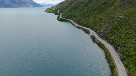 Aerial-view-of-State-Highway-6-as-it-winds-along-the-coast-of-Lake-Wakatipu