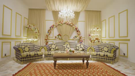 Pan-shot-of-interior-design-of-banquet-with-luxury-couches-and-beautiful-decorations-of-flowers