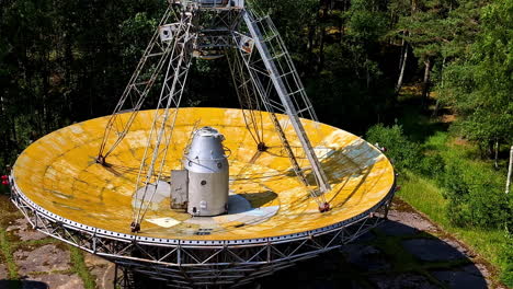 Closeup-shot-of-abandoned-disc-of-RT-32-telescope-kept-on-ground-in-Irbene,-Latva