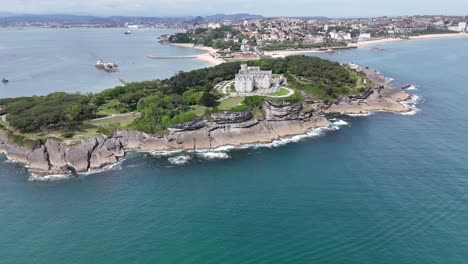 Pull-back-drone-aerial-reverse-reveal-Peninsula,-Magdalena-Santander-Spain-drone,aerial