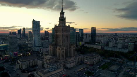 Incredible-panning-aerial-view-focusing-on-Palace-of-culture-tower-in-Poland-at-sunset