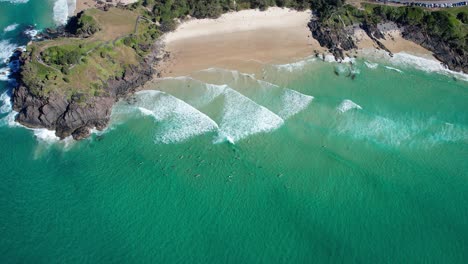 Aerial-View-Of-Surfers-Near-Norries-Headland-During-Summer-In-Cabarita-Beach,-New-South-Wales,-Australia