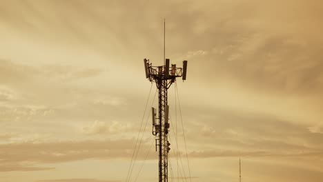 5G-Cell-tower-against-a-golden-sunset-sky,-standing-tall-for-communication-infrastructure