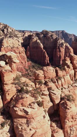 Vertical-Drone-Shot-of-Red-Sandstone-Cliffs-and-Rock-Formations-Above-Sedona-Arizona-USA