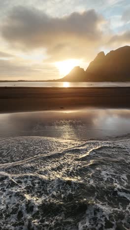 Golden-Sunset-Over-the-Shore-at-Stokksnes-Beach,-Iceland,-vertical-shot