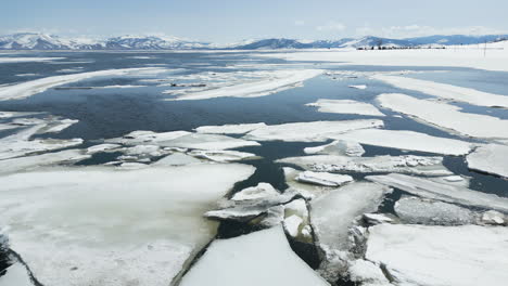 Sierra-Valley-drone-footage-of-the-valley-flooded-in-the-winter-and-covered-in-ice-and-water