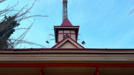 Panoramic-tilt-up-of-a-private,-paid-attraction-inside-the-Fantasilandia-amusement-park-in-Santiago,-Chile-on-a-sunny-day