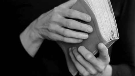 praying-to-god-with-hands-together-with-bible-on-white-background-with-people-stock-video-stock-footage