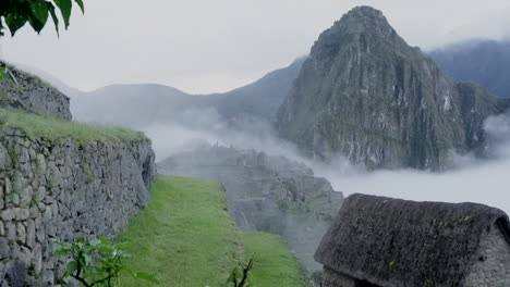 Zoom-out-of-Machu-Picchu-and-Huayna-Picchu-in-cold-rainy-morning