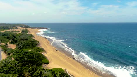 Exotic-sandy-beach-and-road-in-Puerto-Rico,-aerial-view