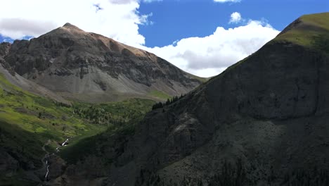 Yankee-Boy-Basin-4wd-hiking-bluesky-cliffside-valley-aerial-drone-Ouray-Ridgway-Stunning-summer-Telluride-Colorado-Box-Canyon-Black-Bear-Pass-Road-Bridal-Veil-Falls-Aspen-Forest-circle-right-motion