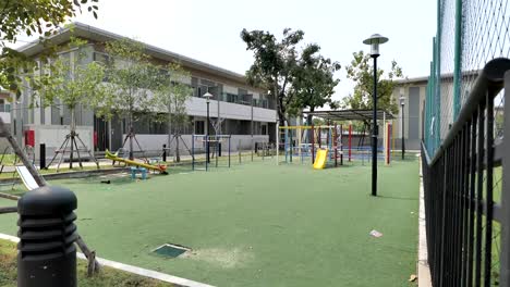 Colorful-Children-Playground-In-The-Garden-On-Sunny-Day