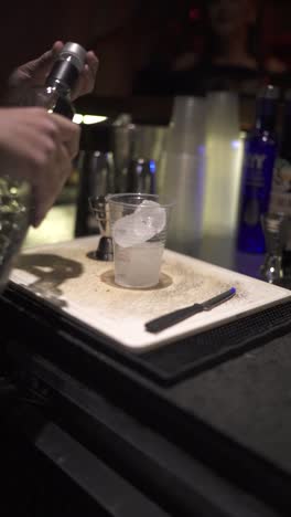 Close-up-of-a-single-use-plastic-cup,-used-to-prepare-cocktails-at-a-party