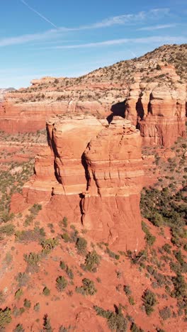 Vertical-Drone-Shot-of-Chimney-Rock,-Red-Sandstone-Tower-Formation-in-Landscape-of-Sedona-Arizona-USA