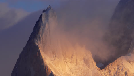 Poincenot-summit-near-Fitz-Roy-covered-by-ethereal-clouds-and-bathed-in-golden-light