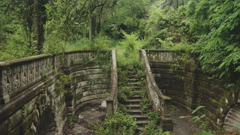 Old-Stone-Staircase-In-Abandoned-Garden---Handheld-Shot