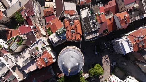 Birds-Eye-Aerial-View-Above-Galata-Tower-on-Busy-Day-in-Istanbul