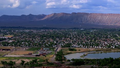 Colorado-River-summer-Grand-Junction-aerial-drone-Grand-Mesa-afternoon-cloudy-blue-sky-wine-vineyards-Parachute-Fruitvale-Mt-Garfield-Western-Close-Delta-downtown-Main-Street-circle-right-motion