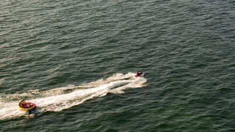 4k-cinematic-drone-stock-footage-of-a-person-riding-a-jetski-in-the-Black-sea-in-romania